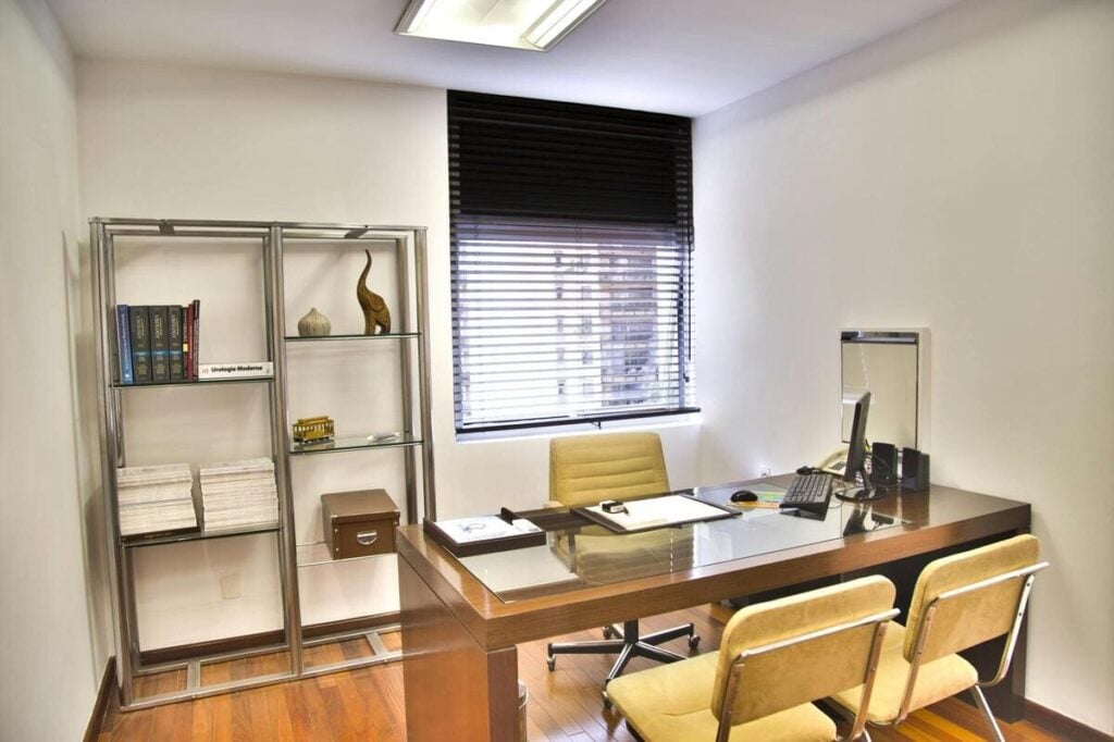 A neat and professional office, possibly a doctor's surgery or consultation room.